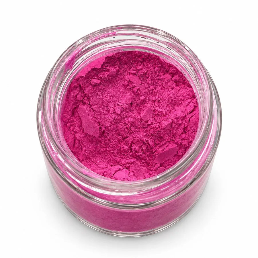 Bright pink red dragon fruit powder in an open jar